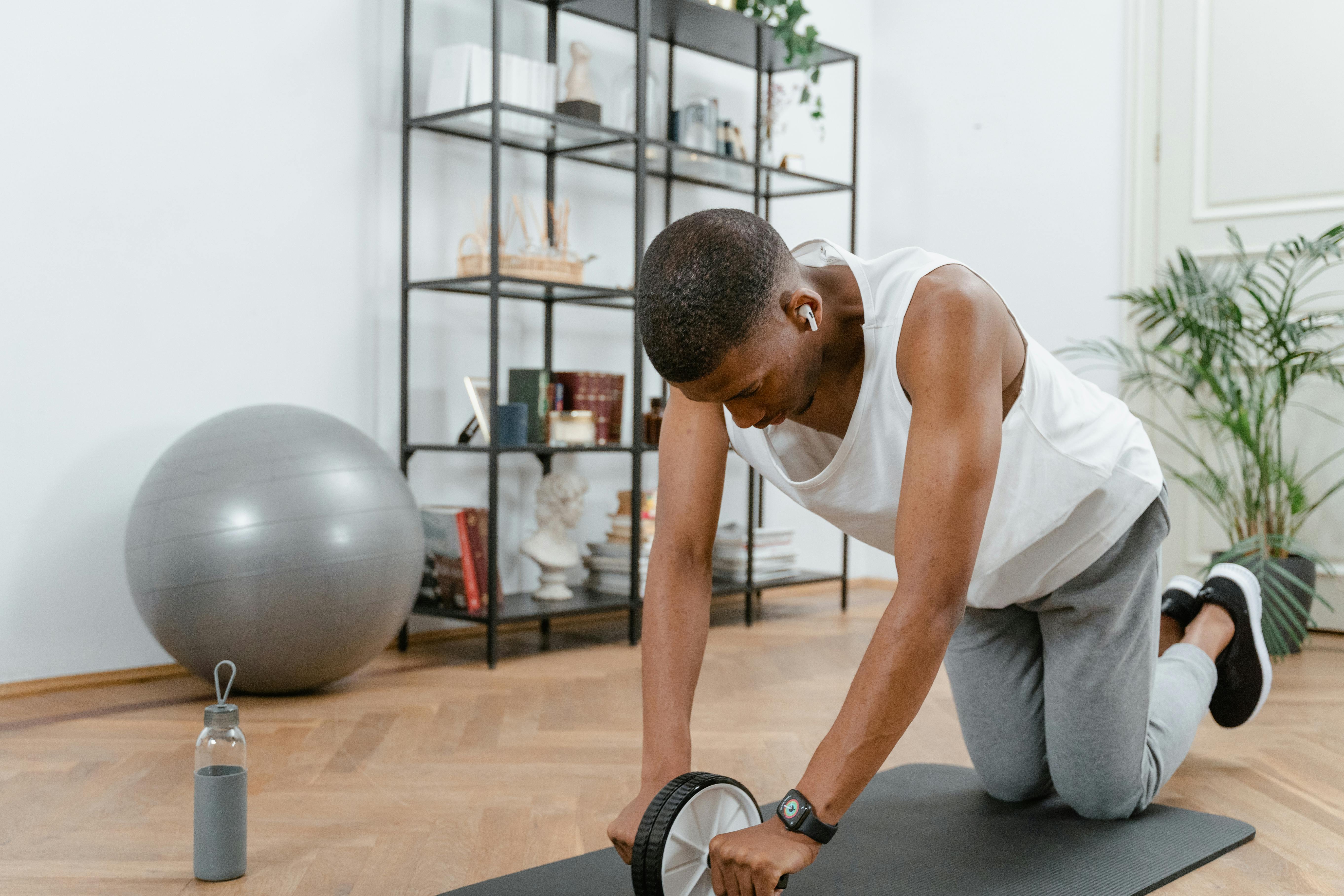 Man performing an ab workout at home to strengthen and sculpt his core muscles