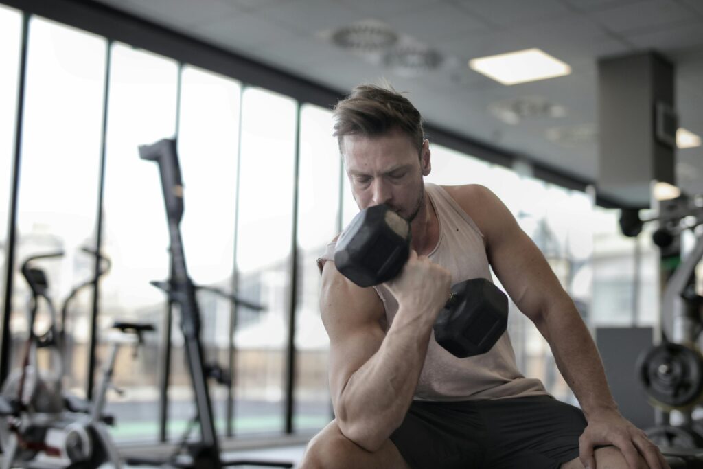 Man performing bicep curls, demonstrating effective workouts to grow bicep