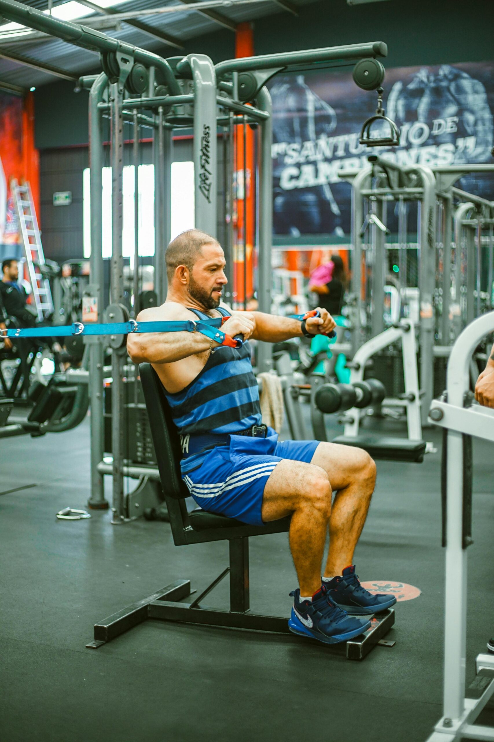 man performing cable flys as part of a workout plan \\to cut fat and build muscle