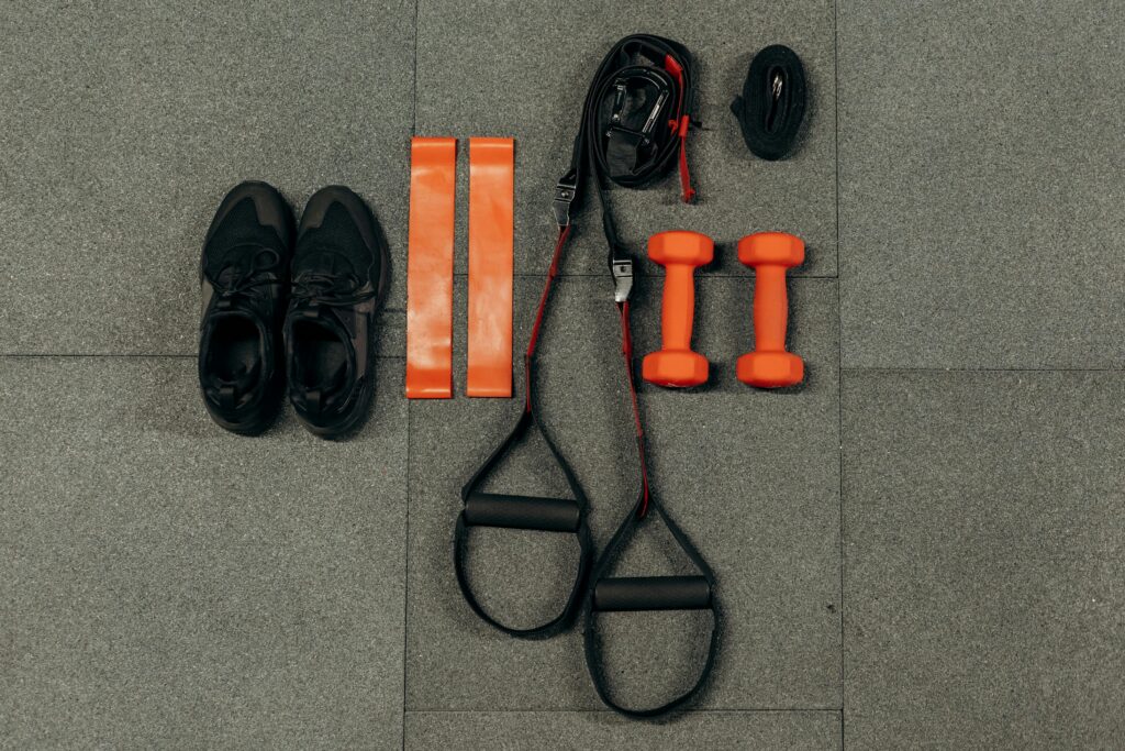 picture of resistance bands, dumbbells, and other gym equipment