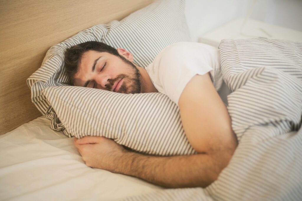 guy sleeping to recover after a workout