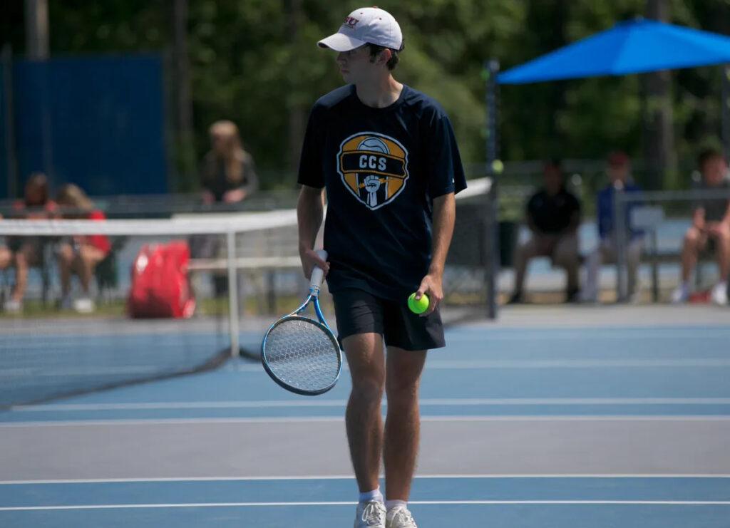 guy playing tennis, demonstrating ways athletes build muscle