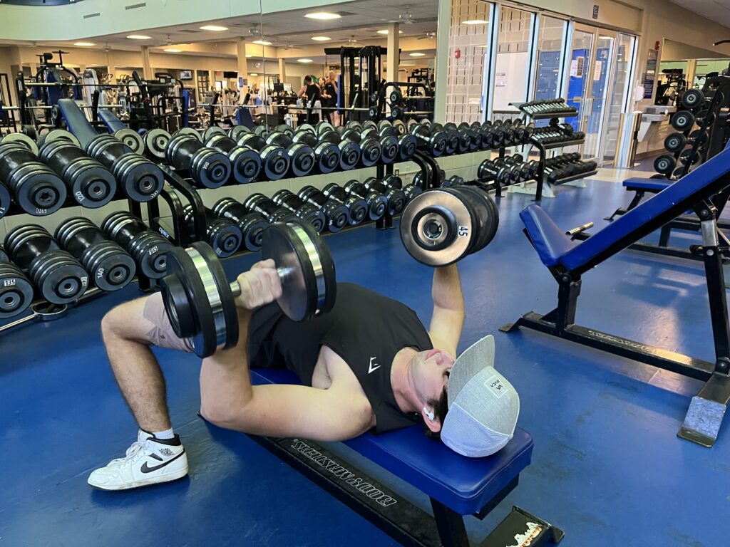 Chest exercises, like this dumbbell press, help increase strength. While enclomiphene can support muscle growth, exercises like this are the foundation for building muscle